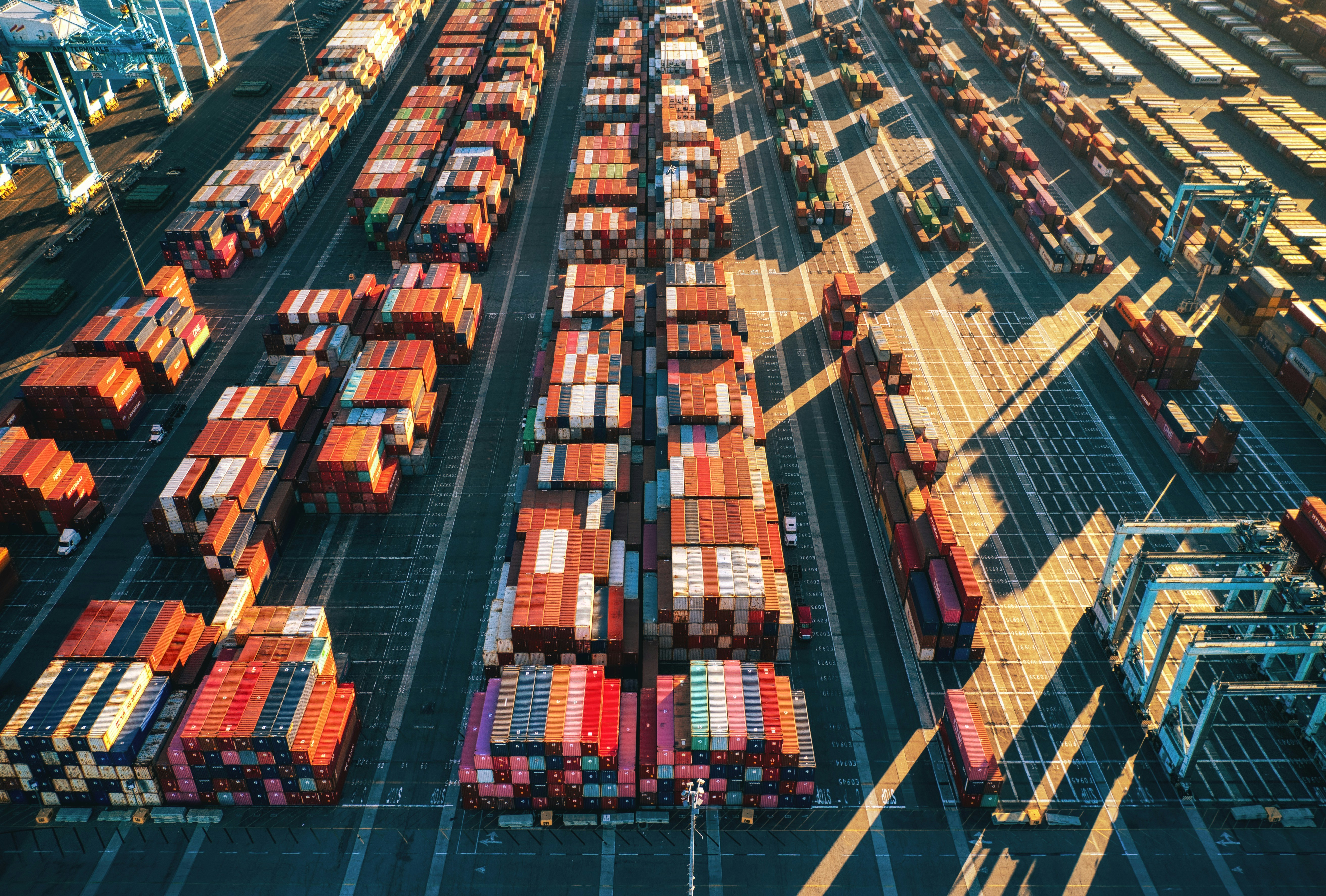 A view from above picturing a dock full of cargo ship containers